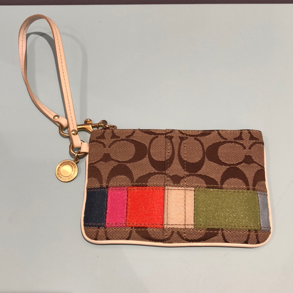 Coach clutch with strap